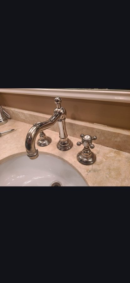 Chrome Faucet on Marble Countertop